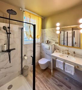 a bathroom with a shower and a toilet and a sink at Beach House Labineca in Gradac +84 photos