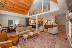 a living room with a couch and a table at Afterglow by Railey Vacations in Oakland +47 photos
