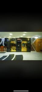 a lobby of a building with a staircase in it at Jawaher hotel in Karbala