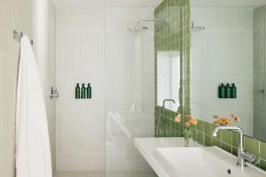 a bathroom with a sink and a shower at Three Ducks in Westhampton +21 photos