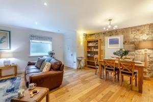 a living room with a couch and a table at 2 Bed in Bamburgh oc-gd1273 in Bamburgh