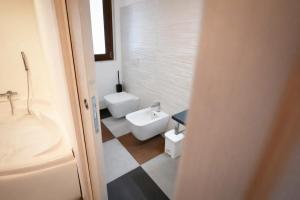 a bathroom with a toilet and a bidet at IL CAMBUSIERE nature relais in Ortona