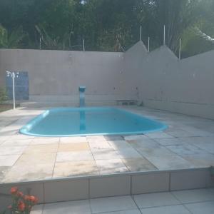 a swimming pool in the middle of a patio at Base Luz na Floresta in Manaus