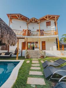a villa with a swimming pool and a house at Pousada Vila Bella Icaraí in Icaraí