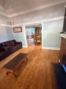 a living room with a couch and a table at Tily's Place in Parkes