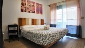 Llit o llits en una habitació de Apartalux Centralmar Centro