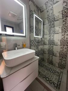 a bathroom with a sink and a mirror at Vila Ramonda in Žabljak