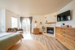a bedroom with a bed and a fireplace at Tolovana 6 in Cannon Beach