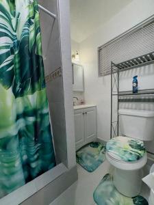 a bathroom with a toilet and a bunk bed at Mermaid's Lighthouse in West Palm Beach +26 photos