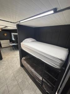 a bunk bed is in a room with at Villa Sonia in Caldera