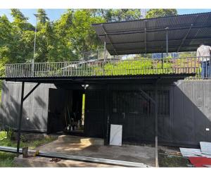 a house under construction with a balcony on top at Villa Sonia in Caldera +9 photos