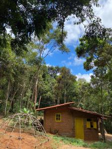 a small house in the middle of a forest at Canto da Águia in Ouro Preto