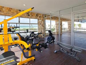 a gym with several exercise bikes in a room at Citnos Luxury Accommodation in Telchac Puerto