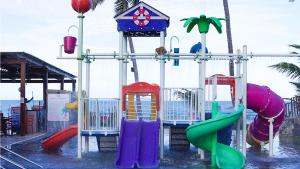 a playground with colorful slides and a water park at GoldMen Vila do Mar Natal in Natal