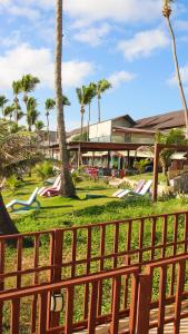 a view of a park with palm trees and slides at GoldMen Vila do Mar Natal in Natal