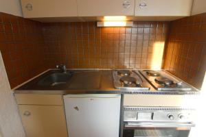 Kuchyň nebo kuchyňský kout v ubytování Trois Vallées Appartements VTI + 37 fotografií