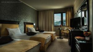 Un pat sau paturi într-o cameră la Hotel Sani