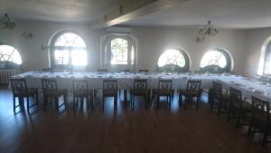 a room with a long table with chairs in it at Dworek Mitro in Gdynia +25 photos