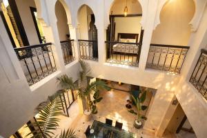 an overhead view of a building with indoor plants at Private Riad Alemania in Marrakesh - Pool - Rooftop in Marrakesh