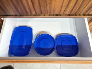 three blue glass vases sitting in a drawer at Cabo Marino Apartment, Pool, Beach and Marina in Conchal