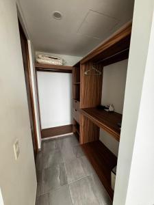 a walk in closet with a large window in a room at Cabo Marino Apartment, Pool, Beach and Marina in Conchal