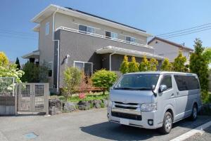 a white van parked in front of a house at GuestHouse　YOU&I in Fujikawaguchiko