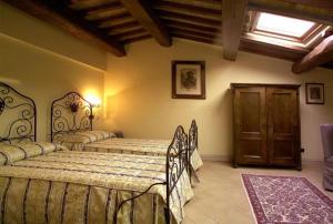 En eller flere senge i et værelse på Palazzo Leti Residenza d'Epoca
