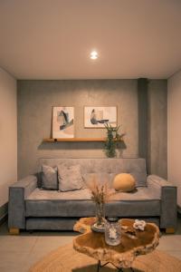 a living room with a couch and a table at Parallelo Loft Salento P1 in Salento