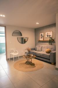 a living room with a couch and a table at Parallelo Loft Salento P1 in Salento