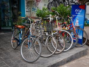 a row of bikes parked next to each other at TT Premium Hostel Vientiane in Vientiane