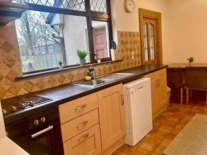 a kitchen with a sink and a window at Leixlip 4-Bed Home Sleeps 6 Ideal for Groups in Kildare