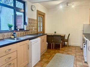 a kitchen with a sink and a table at Leixlip 4-Bed Home Sleeps 6 Ideal for Groups in Kildare