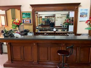 a bar in a store with a mirror at Kim Anh Hotel in Hanoi