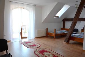 a living room with two beds and a window at Agrotur-Maya in Gorzyca