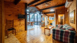 a living room with a couch and a table at Stunning Lakeview Muskoka Pier 100 Resort in Port Carling