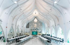 a large room with tables and chairs in a church at W1Bangkoknoi Hotel in Nonthaburi +216 photos
