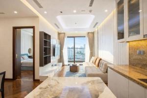 a living room with a couch and a table at Thuý Doji Diamond Apartment in Hai Phong