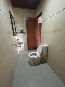 a bathroom with a toilet and a sink at Nami House in Ubud +133 photos