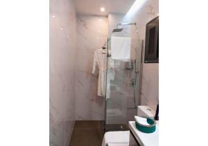a bathroom with a shower and a sink at Aviya - Studio meublé avec chambre et Séjour in Dakar +5 photos