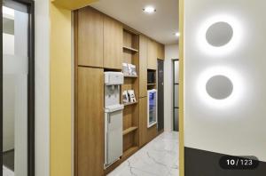 a hallway with a wall with circles on it at Just Sleep Hotel Jihaeng Station in Tongduch'ŏn