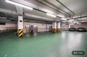 an empty parking garage with cars parked in it at Just Sleep Hotel Jihaeng Station in Tongduch'ŏn