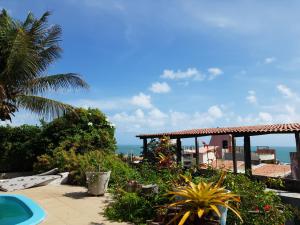 a resort with a view of the ocean at Hotel blue Ocean 3 in Parnamirim