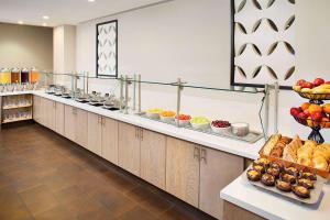 a buffet line with many different types of food at Wyndham Atlanta Perimeter in Atlanta