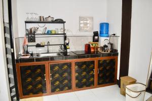 a kitchen with a sink and a counter top at Apartment El Nido in El Nido