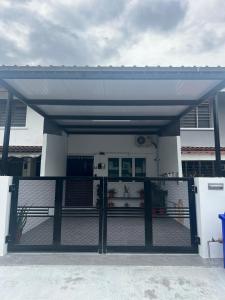 a building with a gate in front of it at Casa for 8 ipoh Central Pet Allowed in Ipoh