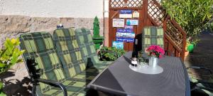 a table and chairs sitting on a patio at Bergsteiger in Sandberg