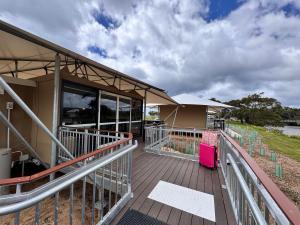 a house with a wooden deck with a building at Apollo Bay Recreation Reserve in Apollo Bay +44 photos