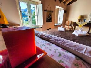 a living room with a couch in the middle of a room at Casa Melabruna, 5 terre biker friendly in Pignone