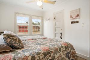 a bedroom with a bed and a window at Cherry Street Star in Bandera