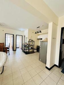 a large room with a kitchen and a living room at THE PRECIOUS TIME LOUNGe in Davao City